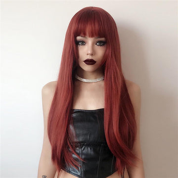 HAIRCUBE firebrick red long wavy wig with bangs worn by model in black leather top