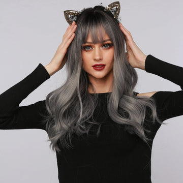La Sylphide nature wave wig with bangs in gray and black worn by model with cat ear headband