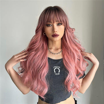 oneNonly long wavy pink wig worn by model with bangs and natural makeup in casual outfit