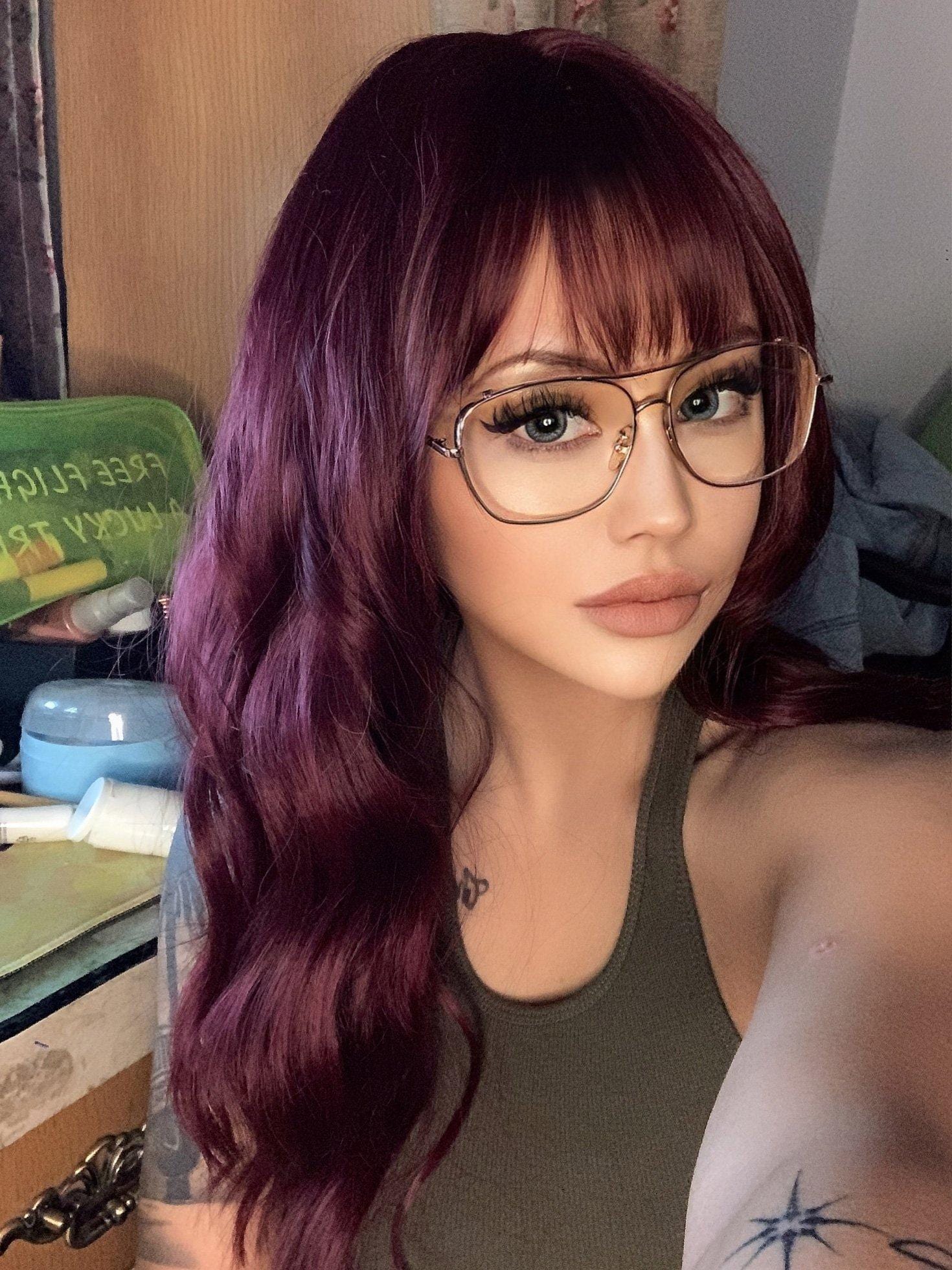 HAIRCUBE 18 inch red wine wig with long wavy hair and bangs worn by woman with glasses