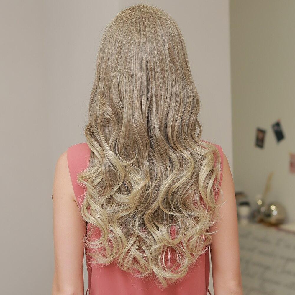 HAIRCUBE 21 inch lace front wig with long wavy blonde hair styled from the back