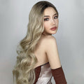 HAIRCUBE 21 inch loose curls wig in blonde shades styled on a model with long flowing hair