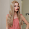 HAIRCUBE 21 inch straight synthetic wig shown on a woman with long blonde hair wearing a coral sleeveless top
