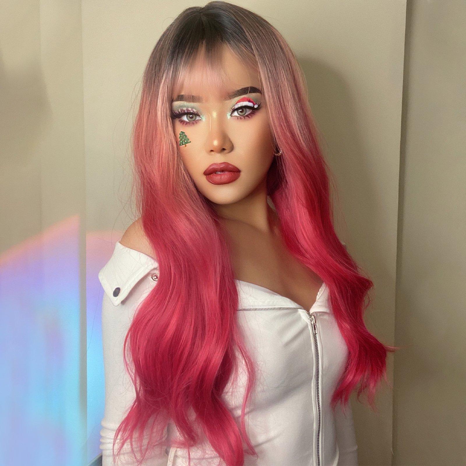 HAIRCUBE 22 inch body wave wig in vibrant pink with dark roots styled on a woman