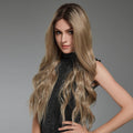 HAIRCUBE 22 inch lace front synthetic wig worn by model with long wavy blonde hair