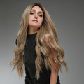 HAIRCUBE 22 inch lace front synthetic wig styled in long wavy blonde hair on a model