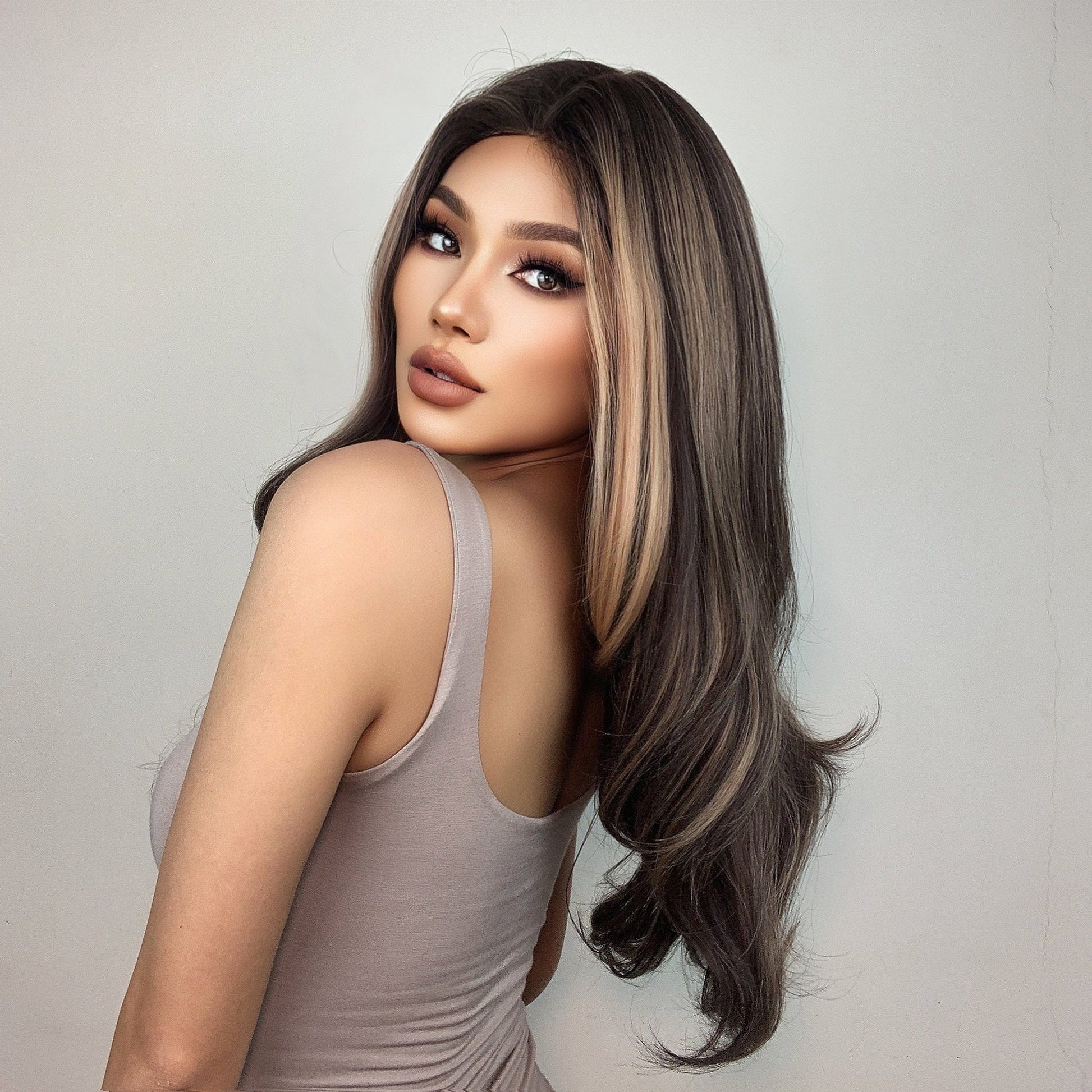 HAIRCUBE 22 inch synthetic lace front wig styled with long dark brown hair and blonde highlights