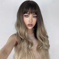 23 inch ombre ash blonde wig by HAIRCUBE with long wavy hair and bangs on model