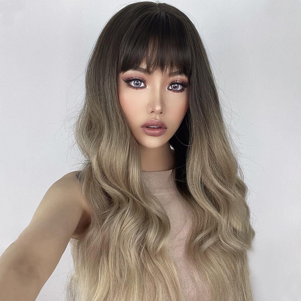 23 inch ombre ash blonde wig by HAIRCUBE with long wavy hair and bangs on model