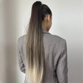 24 inch synthetic ponytail extension worn by woman with long ombre hair in black and blonde shades