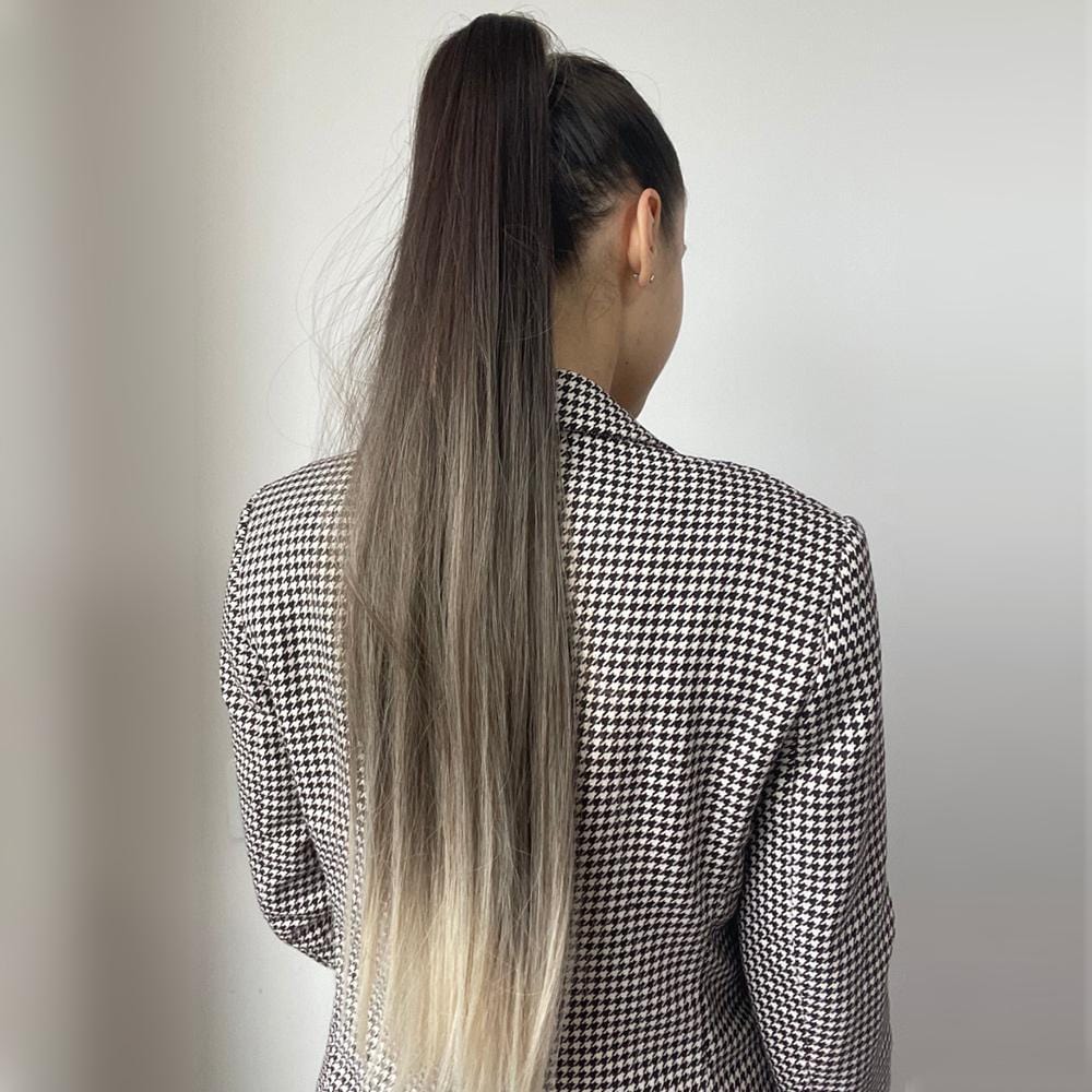 24 inch synthetic ponytail extension worn by woman with long ombre hair in black and blonde shades