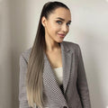 Woman wearing 24 inch synthetic ponytail extension with smooth ombre hair styled in high ponytail