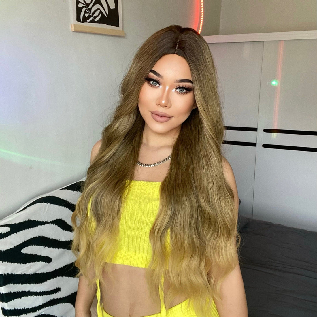 HAIRCUBE 26 inch extra long wavy synthetic wig styled on a woman with ombre light brown to blonde hair