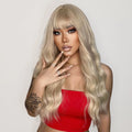 26 inch synthetic wig with bangs by oneNonly styled in long wavy blonde hair on a model