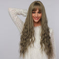 La Sylphide 24 inch cosplay wig with long wavy ash brown hair and bangs on a smiling model