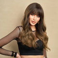 HAIRCUBE dark brown long curly synthetic wig worn by woman with bangs and loose curls