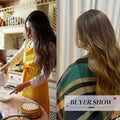 Ombre brown synthetic wig styled in loose waves showcased by a woman baking and wrapped in a striped blanket