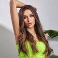 Woman wearing Alan ombre brown synthetic wig styled in loose waves with natural shine