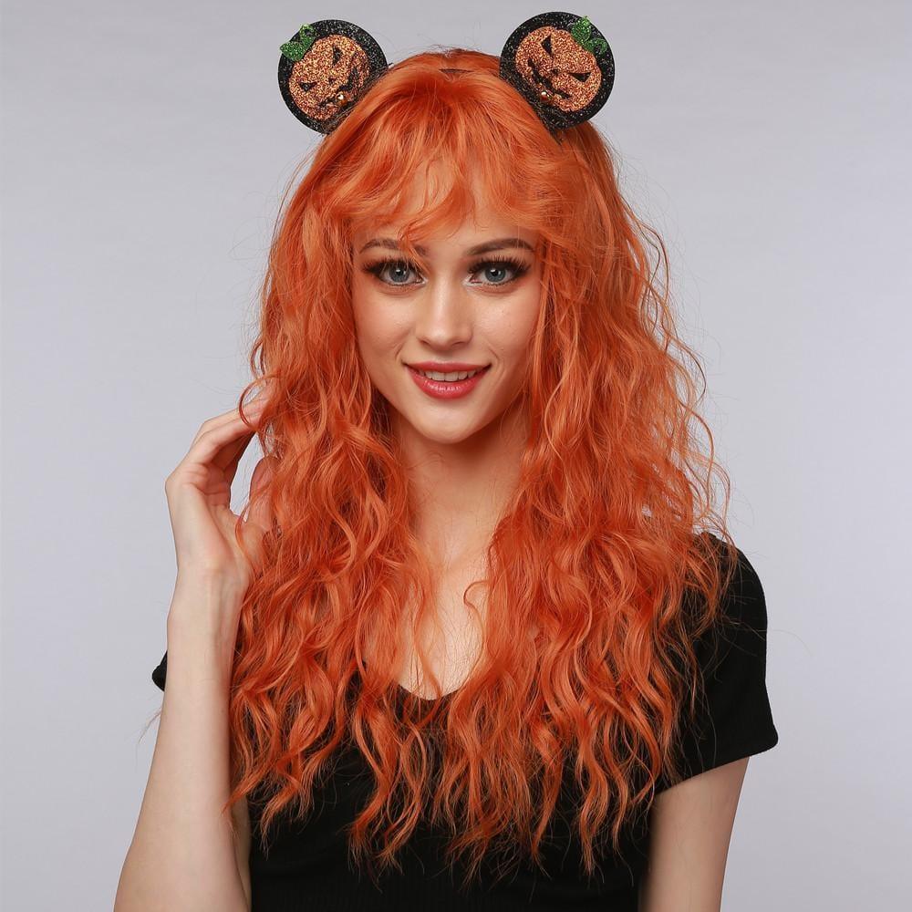 La Sylphide ginger red synthetic wig with long wavy hair and bangs styled on a smiling woman
