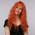La Sylphide ginger red synthetic wig with long wavy hair styled on female model