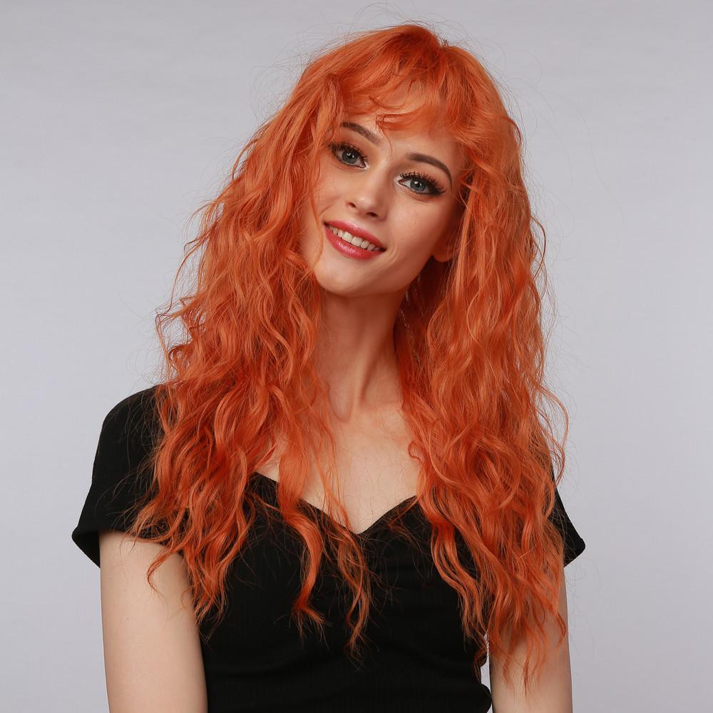La Sylphide ginger red synthetic wig with long wavy hair styled on female model