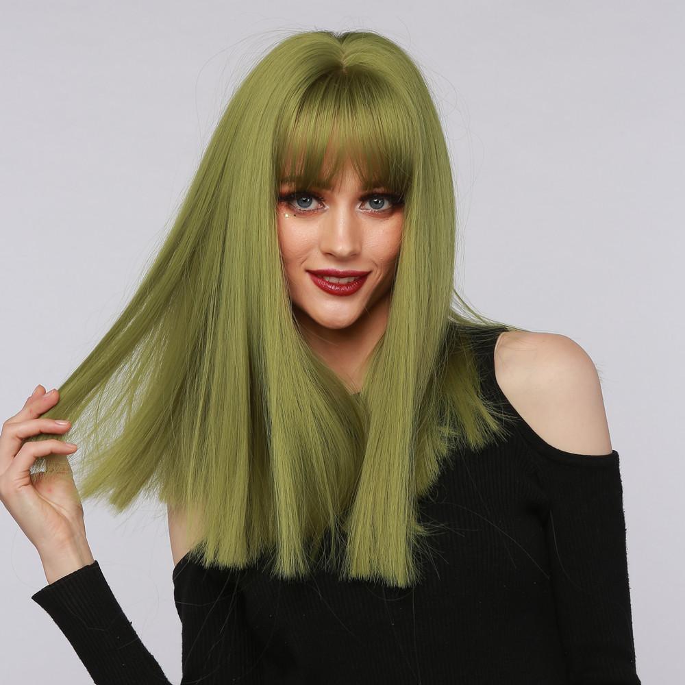 La Sylphide lime green synthetic wig with long straight hair and bangs on woman in black top