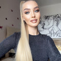 Woman wearing a long synthetic ponytail extension with straight blonde hair styled in a high ponytail