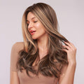 HAIRCUBE mix brown synthetic wig with long wavy layers and natural highlights on woman
