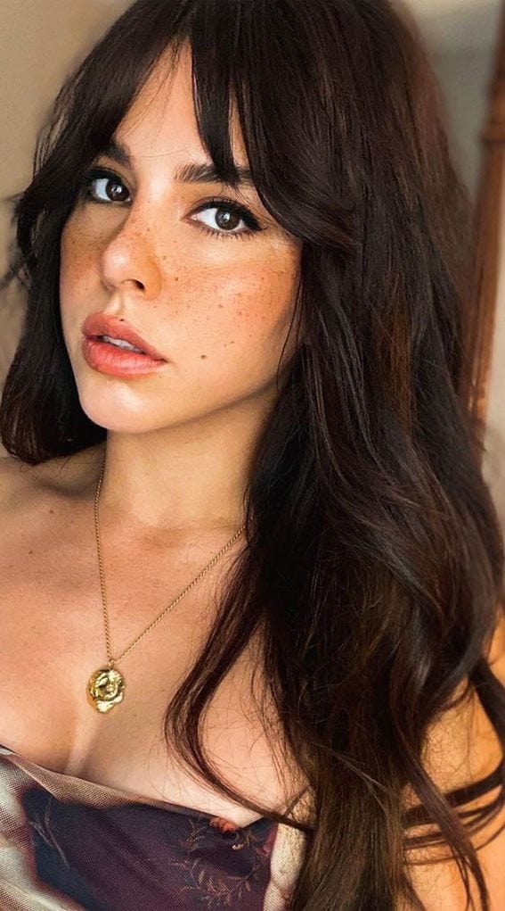 HAIRCUBE natural looking brown human hair wig styled with soft waves on a woman