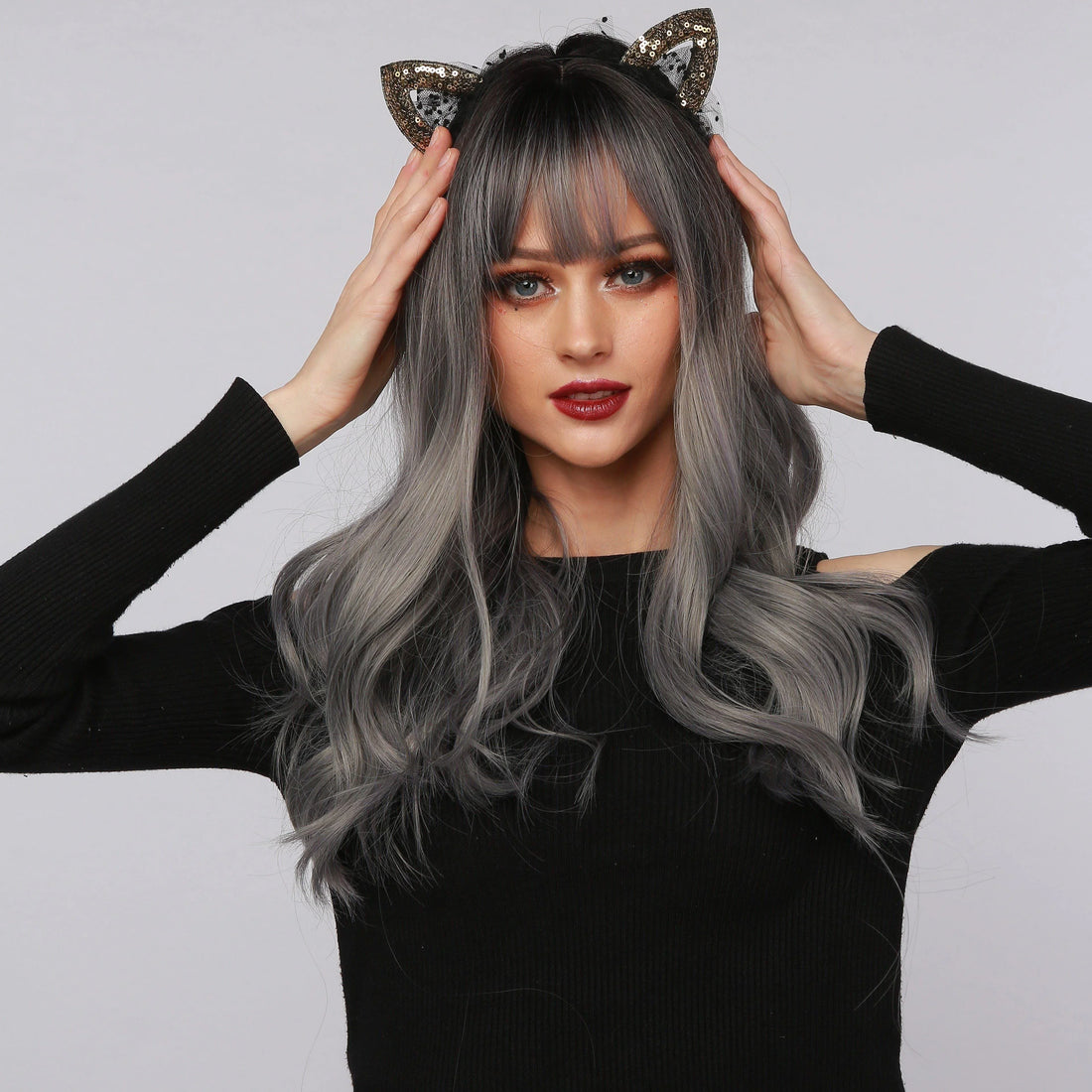 La Sylphide nature wave wig with bangs in gray and black worn by model with cat ear headband