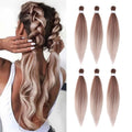HAIRCUBE peach pink hair extensions shown in long straight bundles and worn in braided hairstyle