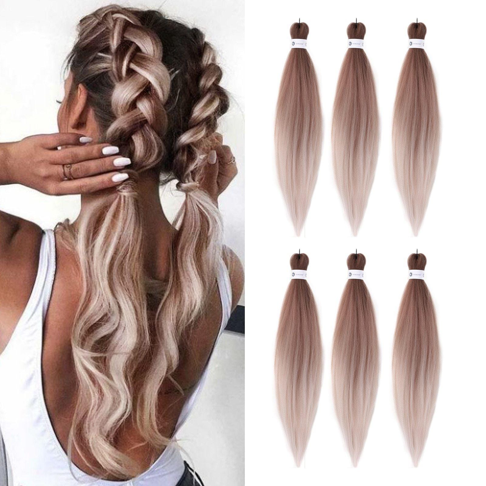 HAIRCUBE peach pink hair extensions shown in long straight bundles and worn in braided hairstyle