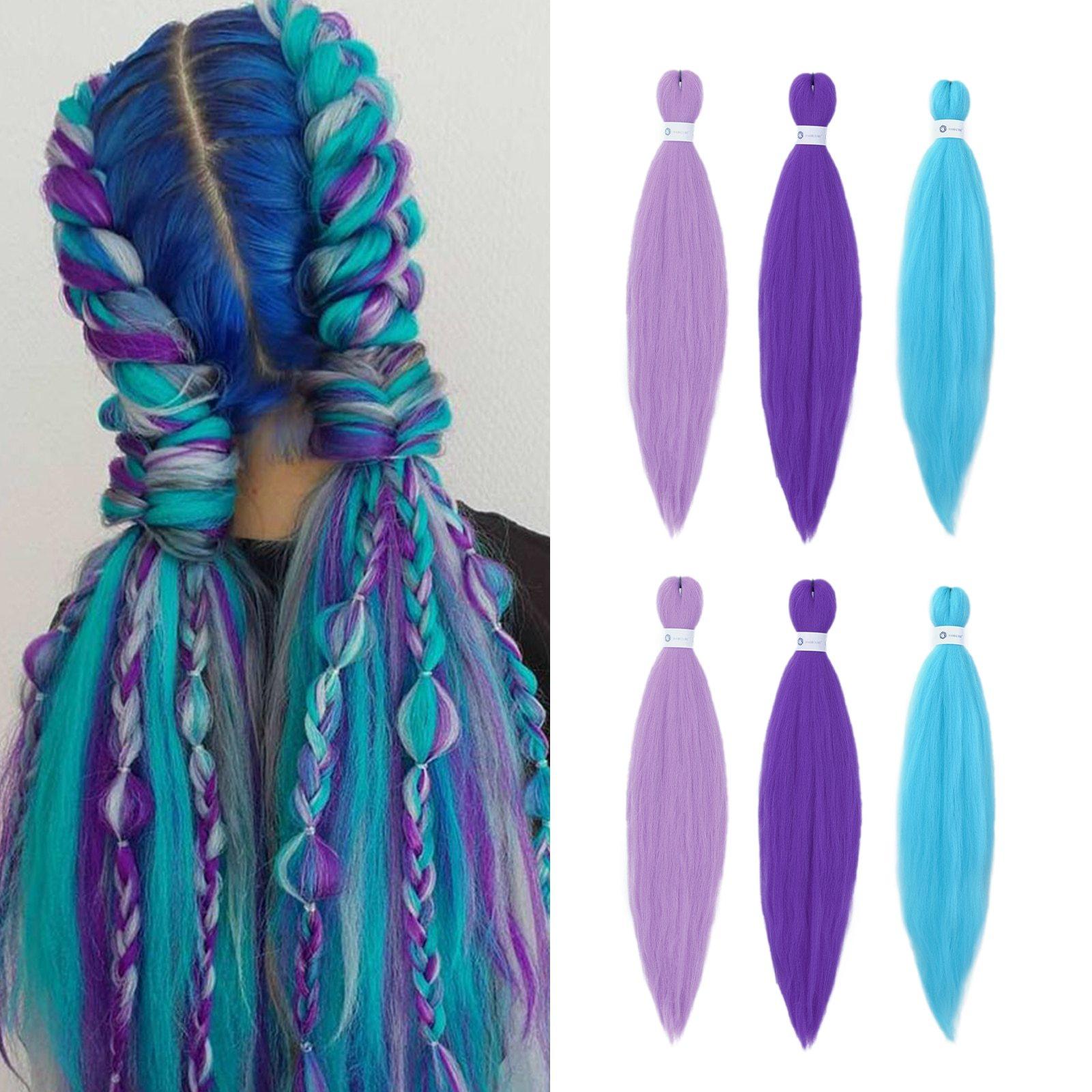 HAIRCUBE wig with colorful braids and vibrant blue, purple, and turquoise hues, showcasing peach pink hair extensions