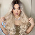 HAIRCUBE 21 inch synthetic wig with long wavy blonde hair and dark roots styled on model