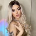 HAIRCUBE 21 inch synthetic wig with long wavy blonde ombre hairstyle on model
