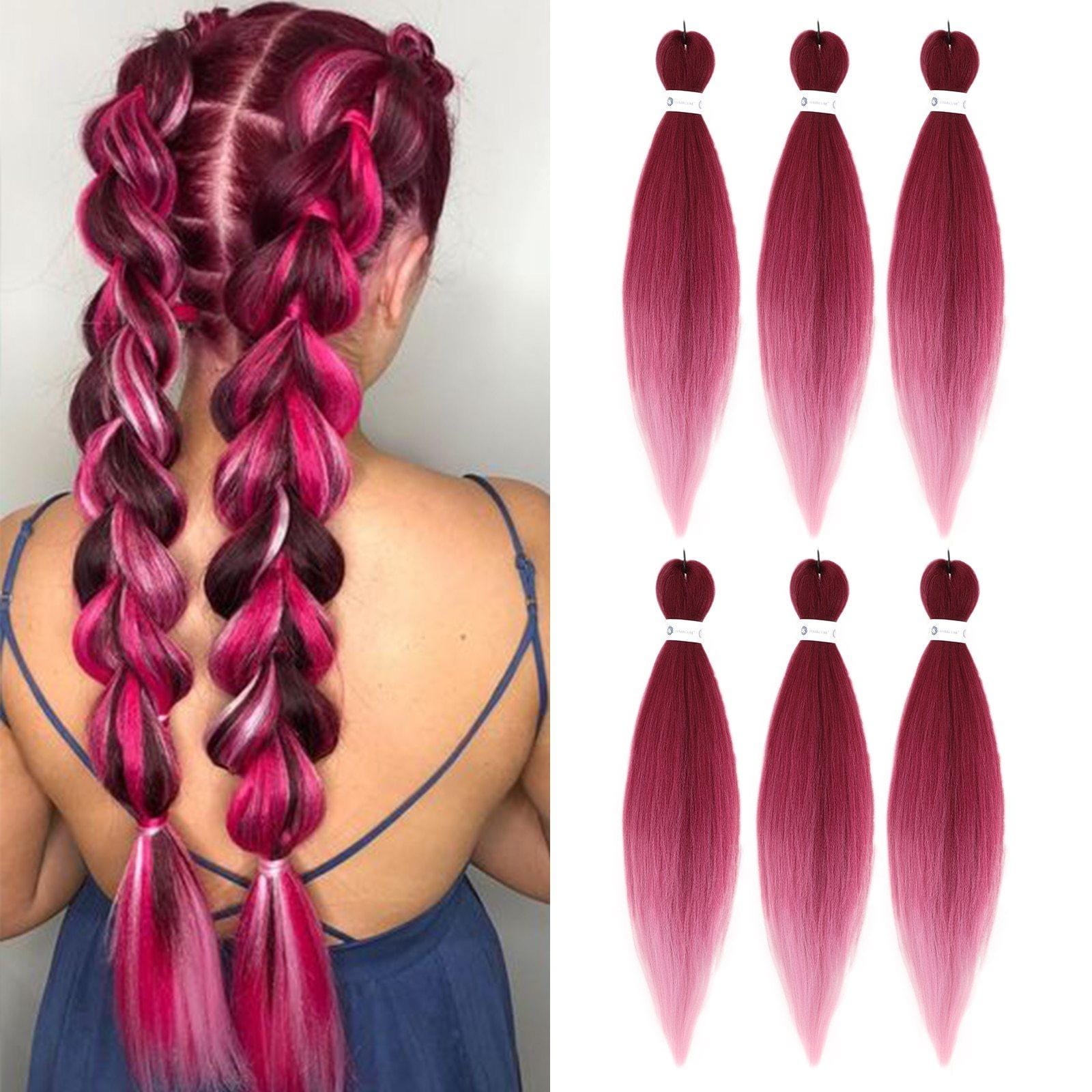 HAIRCUBE rainbow hair extensions 26 inch in vibrant pink shades styled in braided hair and displayed in six bundles