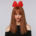 HAIRCUBE reddish brown synthetic wig with straight long hair and bangs worn with red bow headband