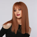 HAIRCUBE reddish brown synthetic wig with straight long hair and bangs on a woman