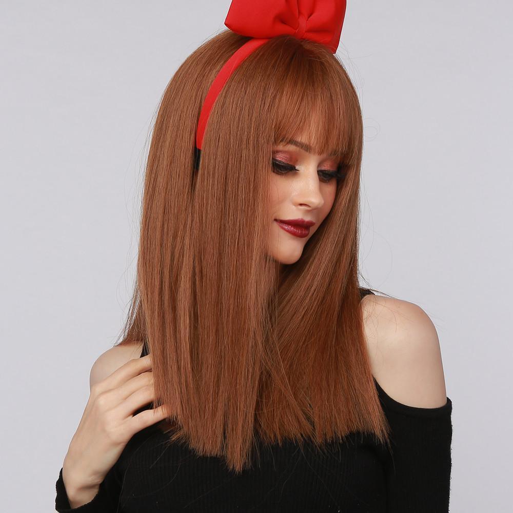 HAIRCUBE reddish brown synthetic wig with straight long hair and bangs worn by model with red headband