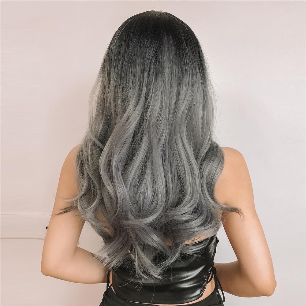 Back view of HAIRCUBE silver synthetic wig with bangs featuring long wavy hair