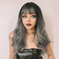 HAIRCUBE silver synthetic wig with bangs featuring long wavy hairstyle and dark roots