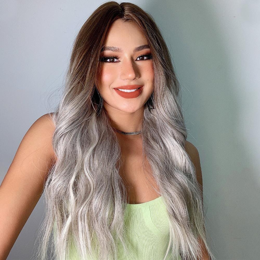 HAIRCUBE smokey grey synthetic wig with long wavy hair styled on a smiling woman
