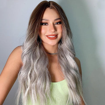 HAIRCUBE smokey grey synthetic wig with long wavy hair styled on a smiling woman