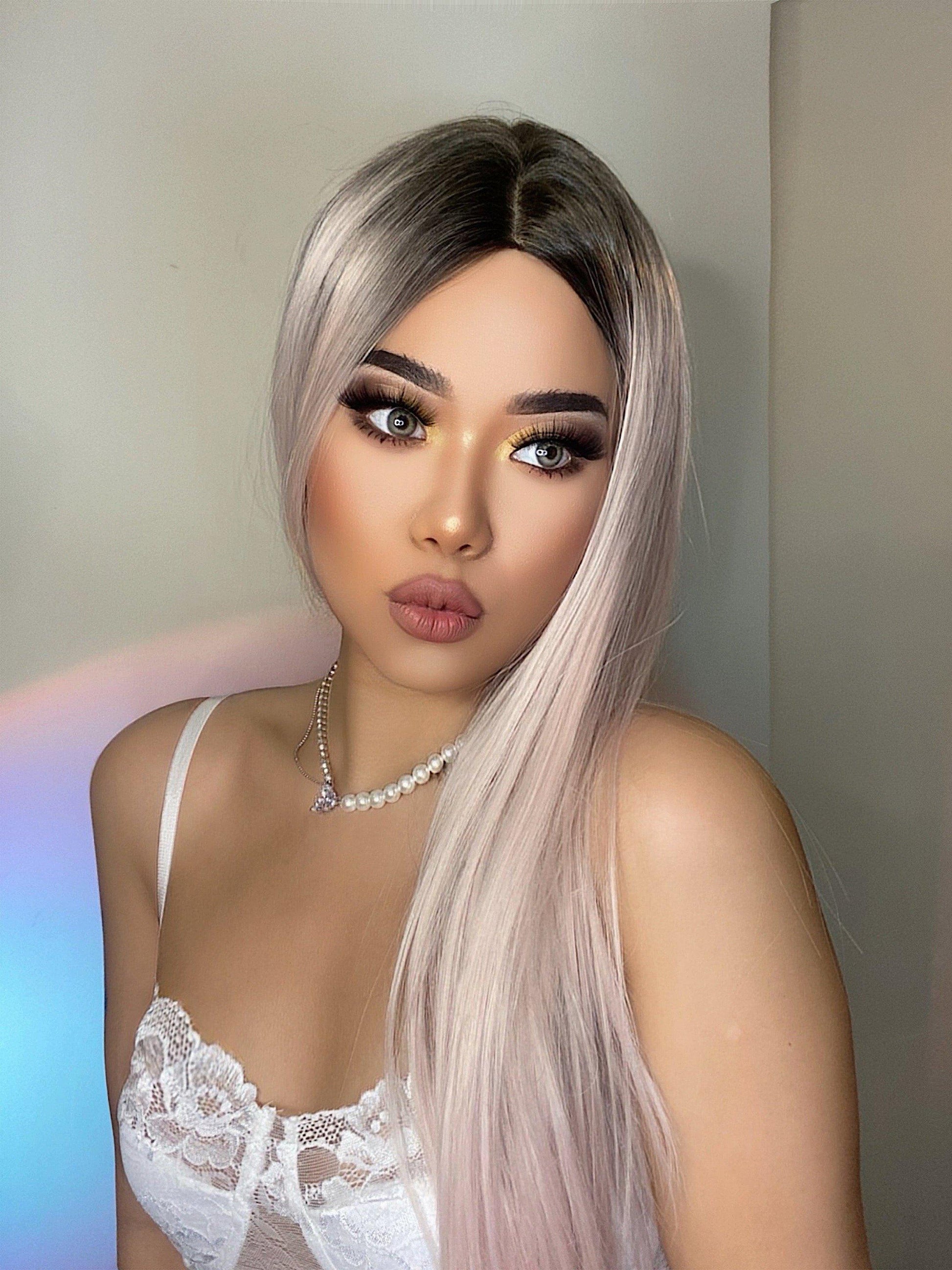 HAIRCUBE vanilla rose gold synthetic wig with long straight hair and dark roots on model