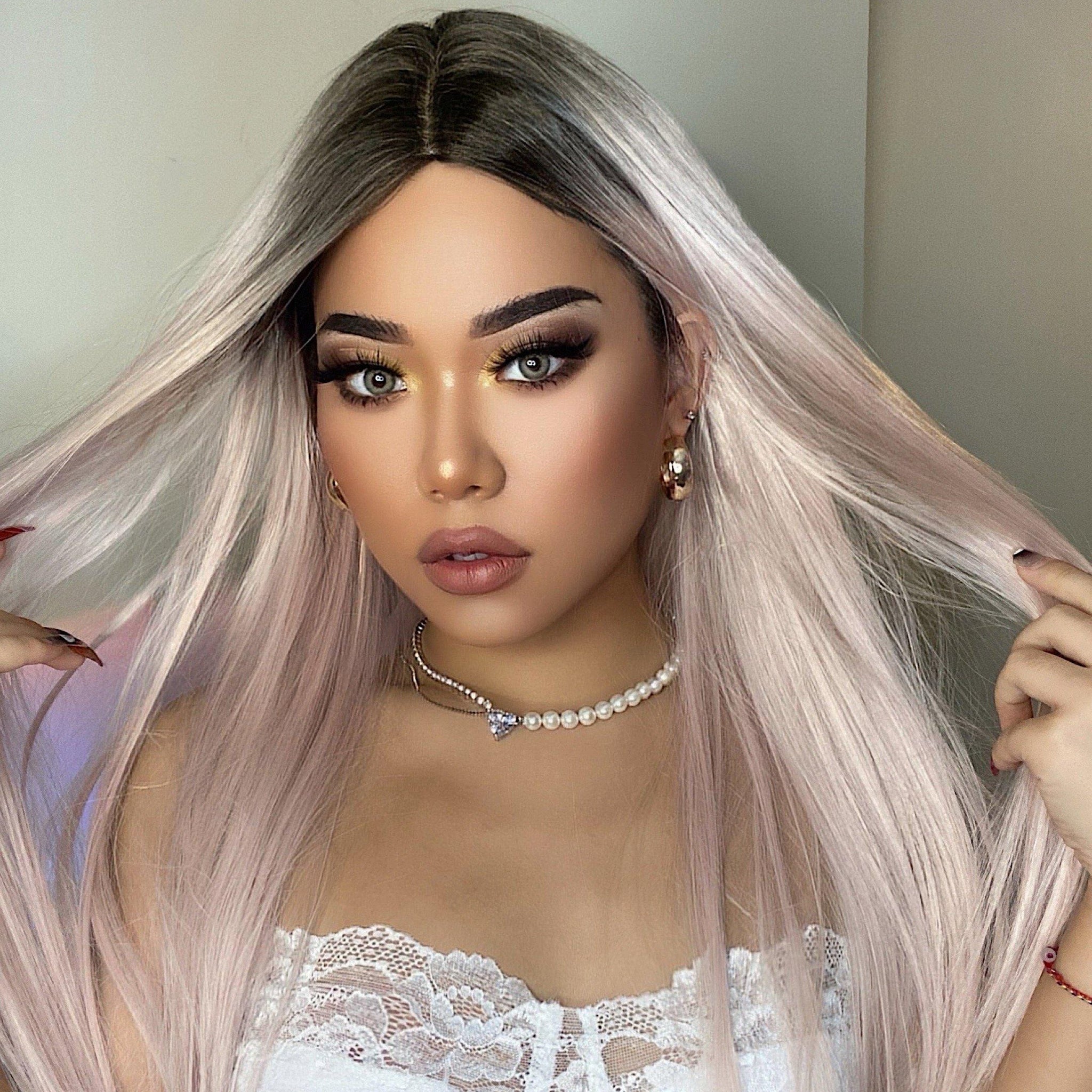 HAIRCUBE vanilla rose gold synthetic wig worn by a model with long straight hair and dark roots