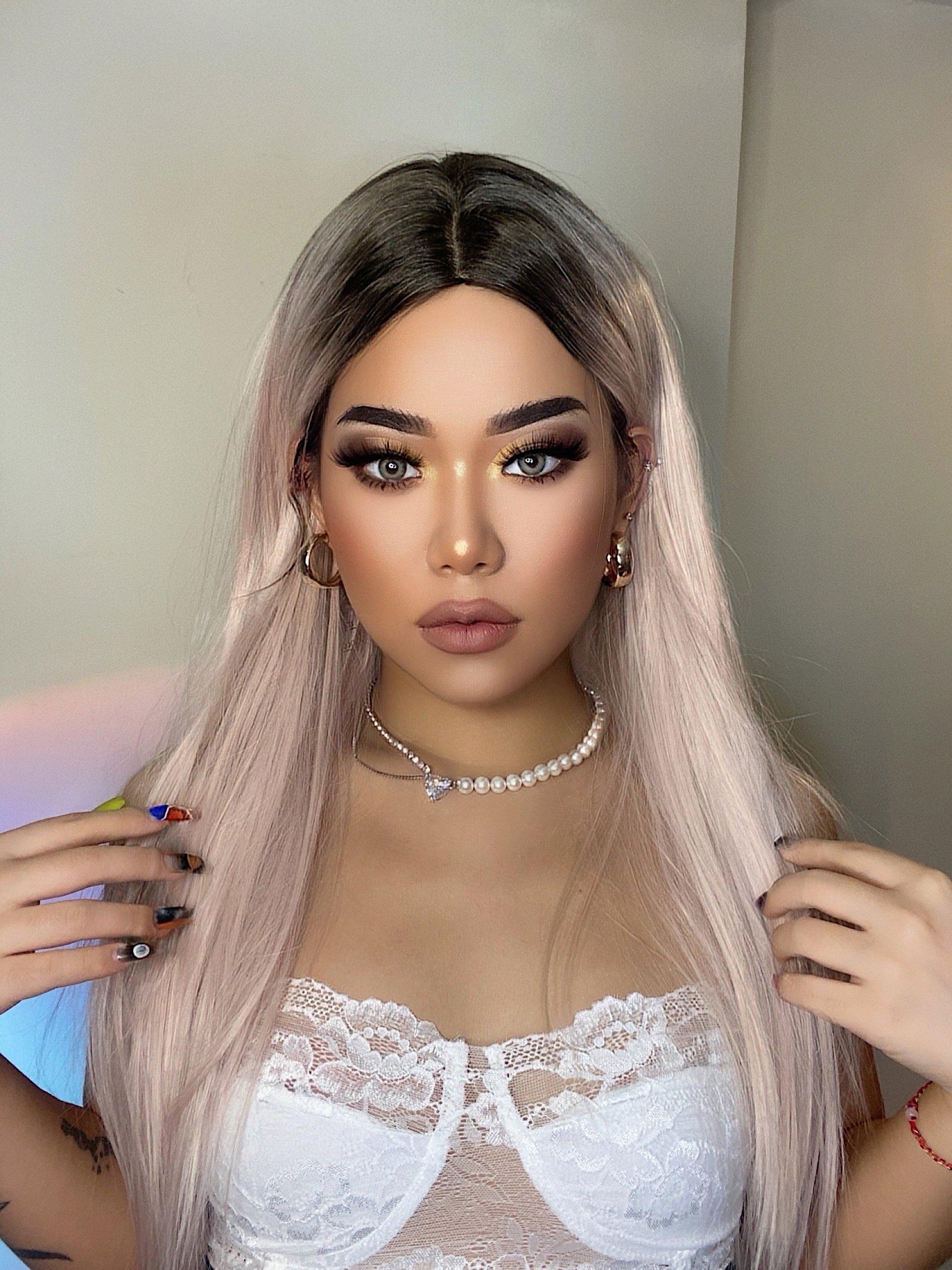 HAIRCUBE vanilla rose gold synthetic wig styled on model with long straight hair and dark roots