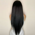 HAIRCUBE 23 inch free part synthetic wig with long straight black hair styled from the back