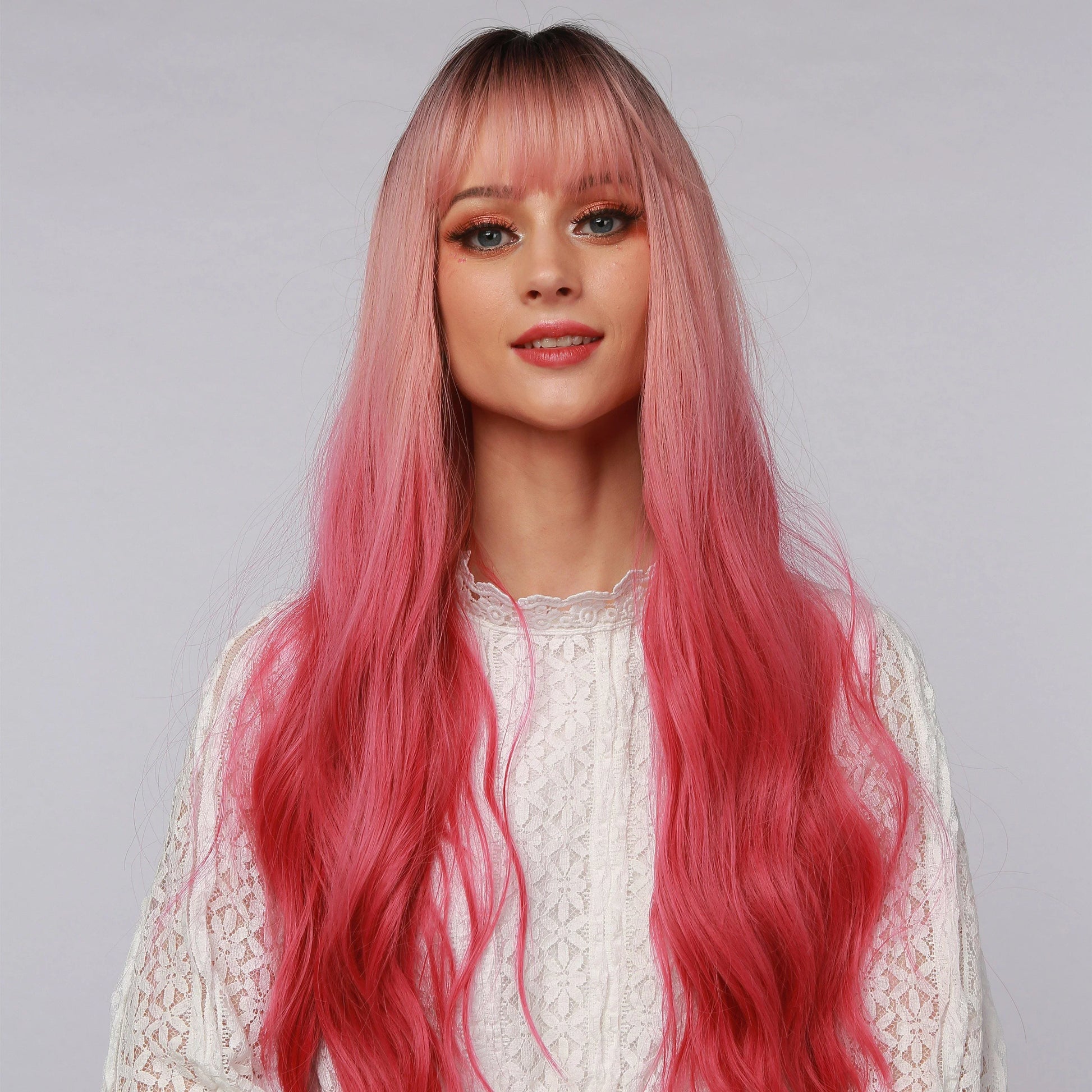 La Sylphide 23 inch pink ombre cosplay wig with long wavy hair and bangs on model