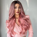 HAIRCUBE 23 inch pink synthetic wig with long wavy hair styled on woman wearing a pink top