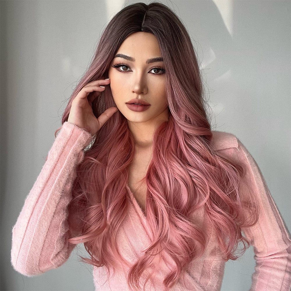 Woman wearing 23 inch pink synthetic wig with long wavy hair styled naturally